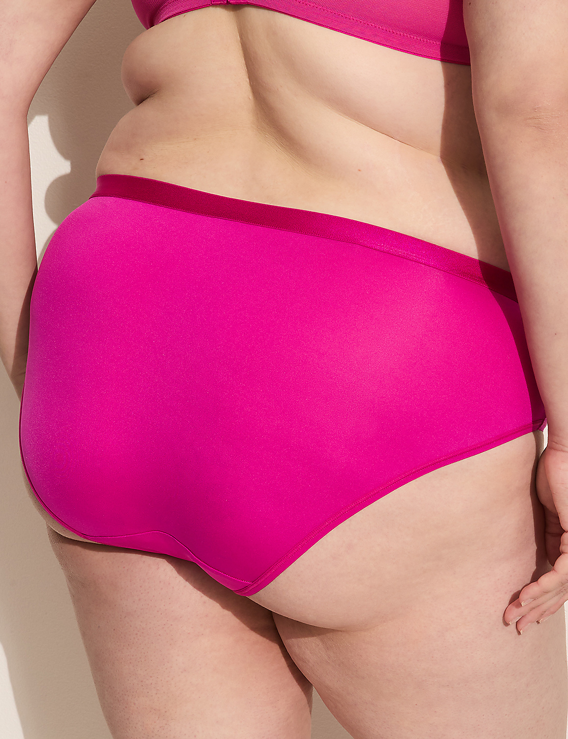 A person's back, wearing bright pink underwear and a matching bra, is shown against a plain white background. Product Image 2
