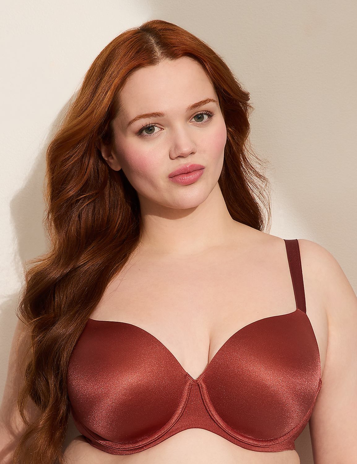 A woman with long, wavy red hair poses in a rust-colored bra against a plain, light-colored background. Product Image 1