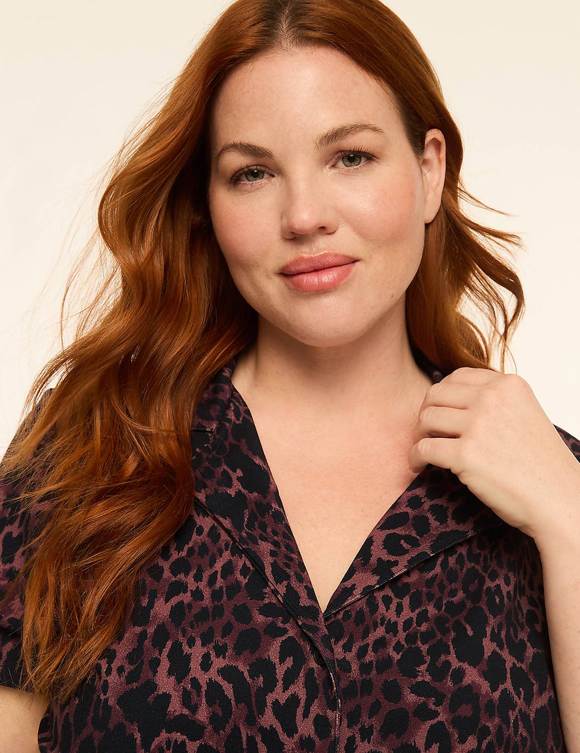 A woman with long, wavy red hair and a leopard-print shirt is shown against a plain, light-colored background. Product Image 3