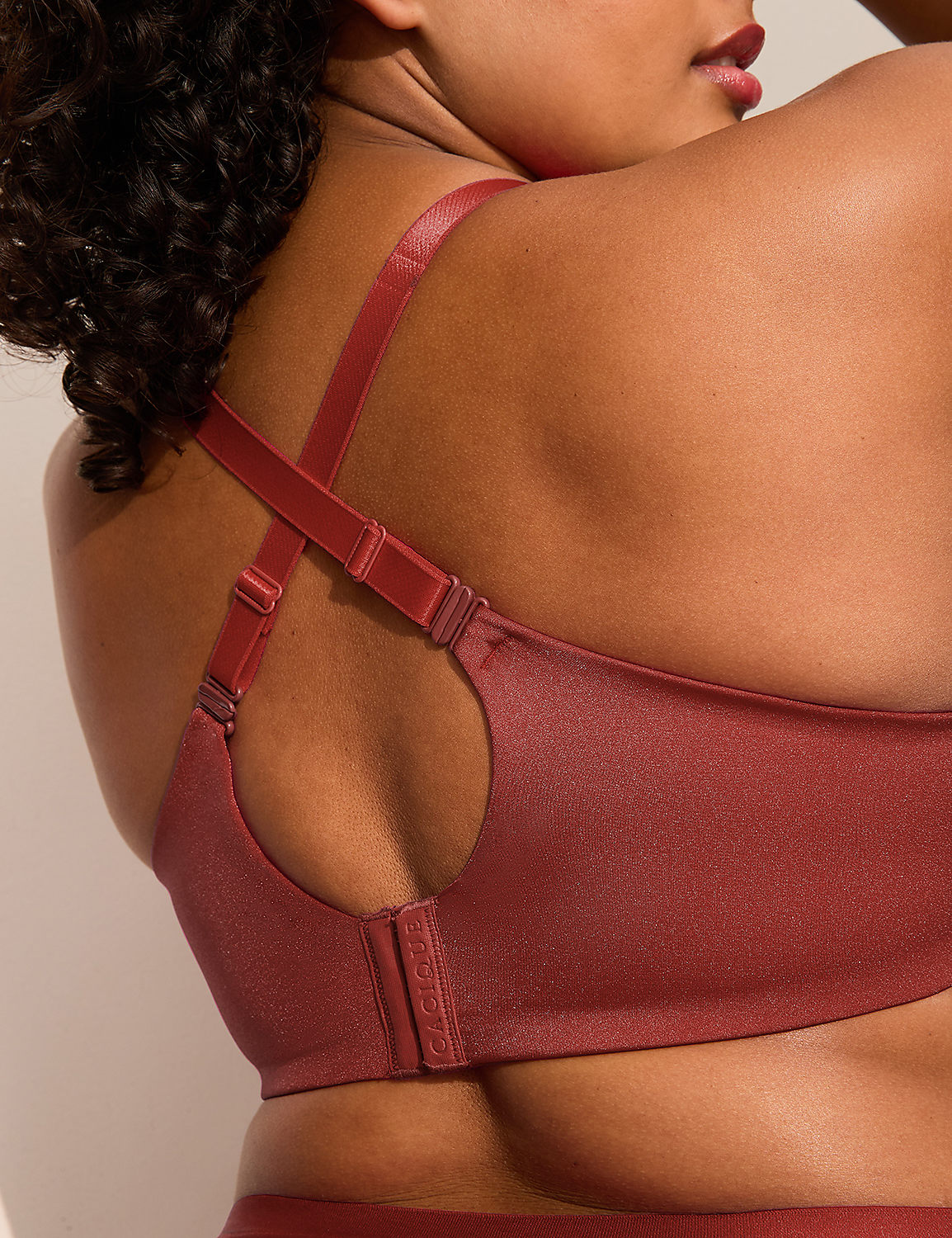 A close-up of a woman's back in a rust-colored bra with a blurred, light-colored background. Product Image 5