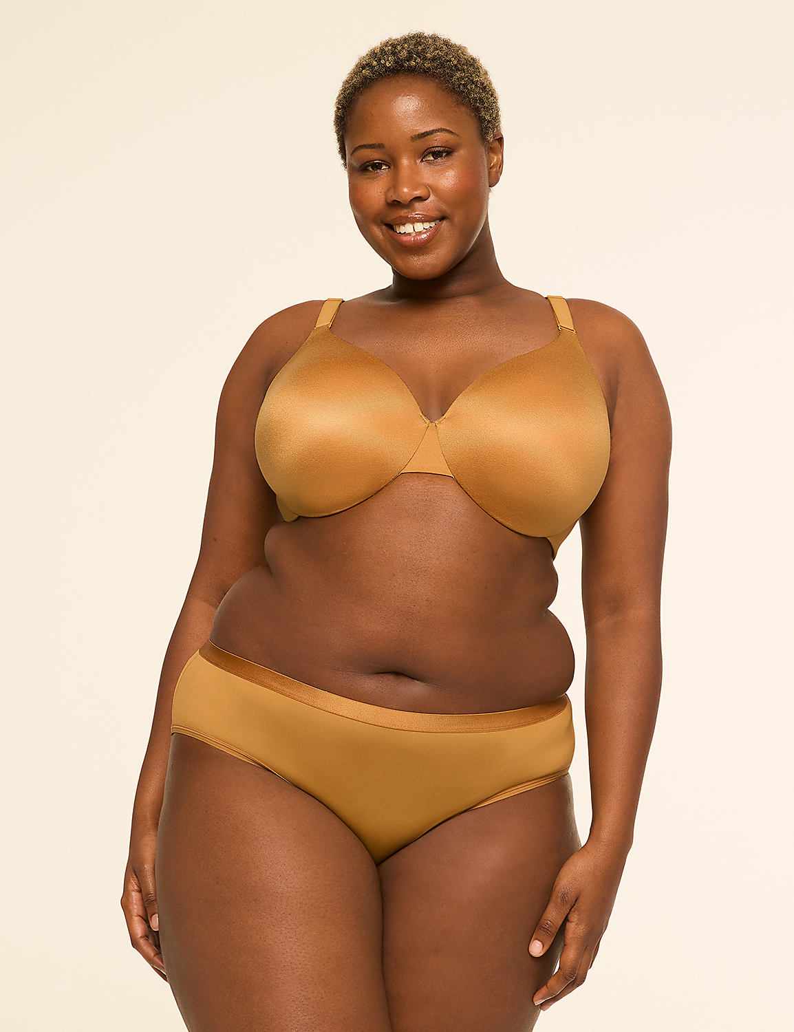 A smiling woman in a tan bra and underwear stands against a plain, light-colored background. Product Image 4