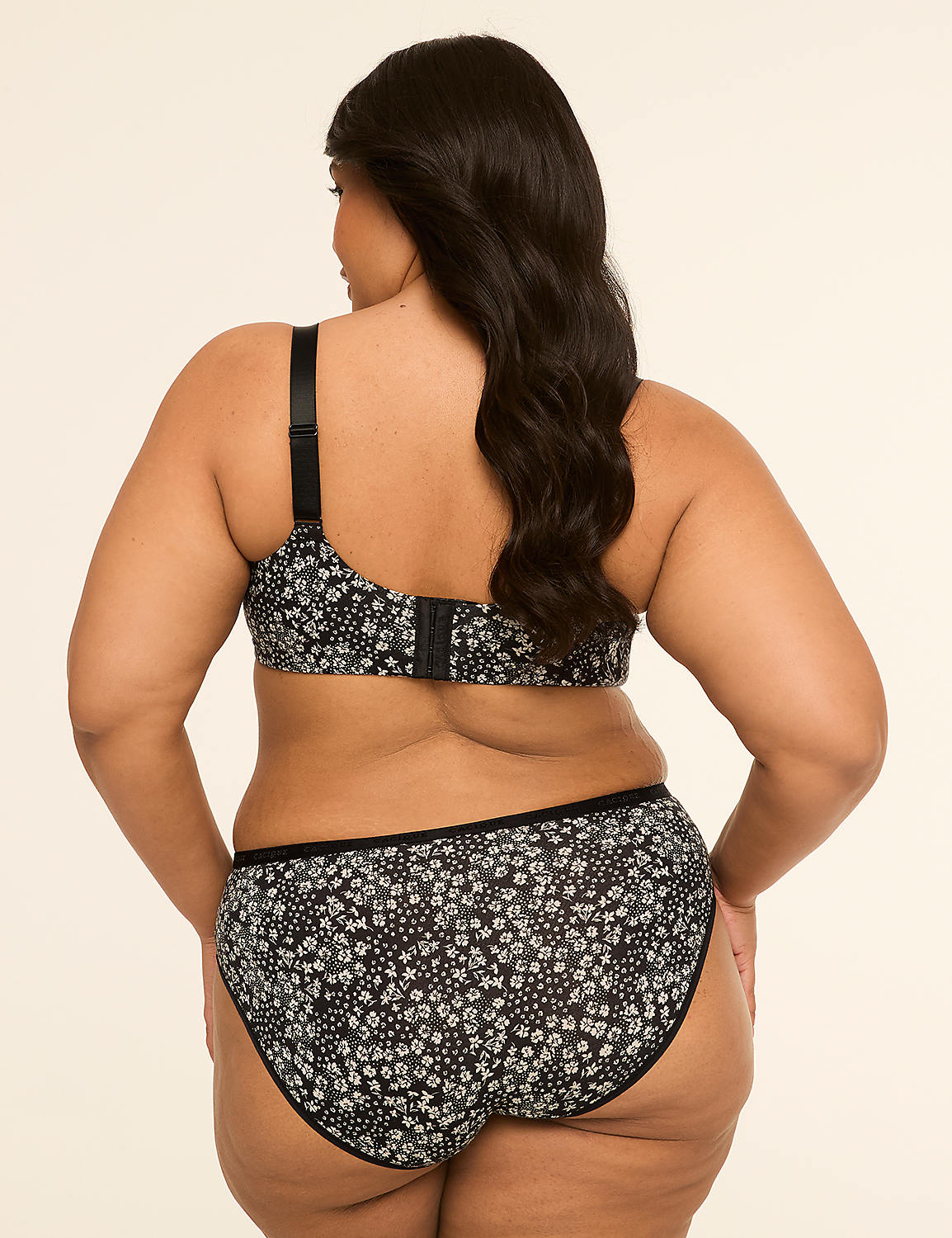 A woman in a floral bra and underwear stands against a plain, light-colored background. Product Image 2