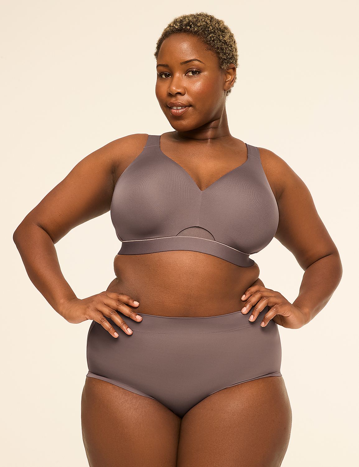 A woman with short, blonde hair poses confidently in a grey bra and matching underwear against a plain, light-colored background. Product Image 4