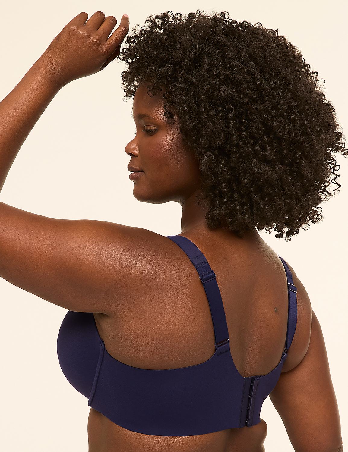 A woman with dark, curly hair is shown from the back, wearing a navy blue bra against a plain, light-colored background. Product Image 3