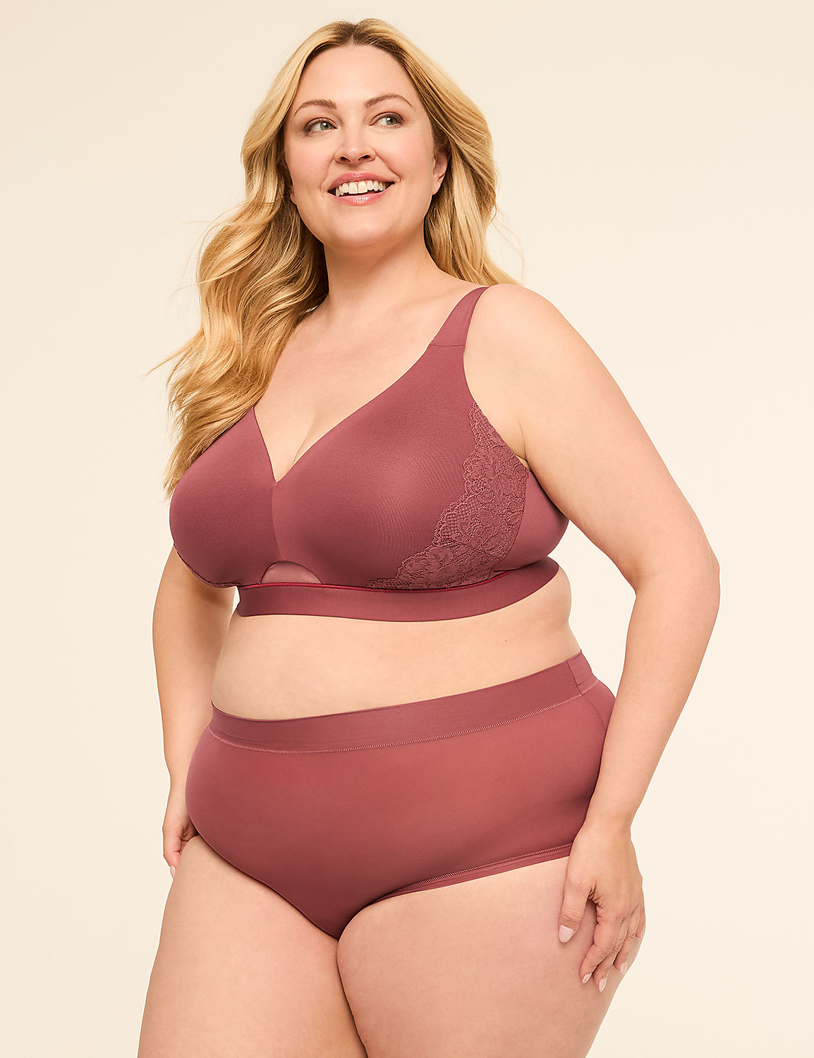 A smiling woman in a mauve bra and matching underwear stands against a plain, light-colored background. Product Image 4
