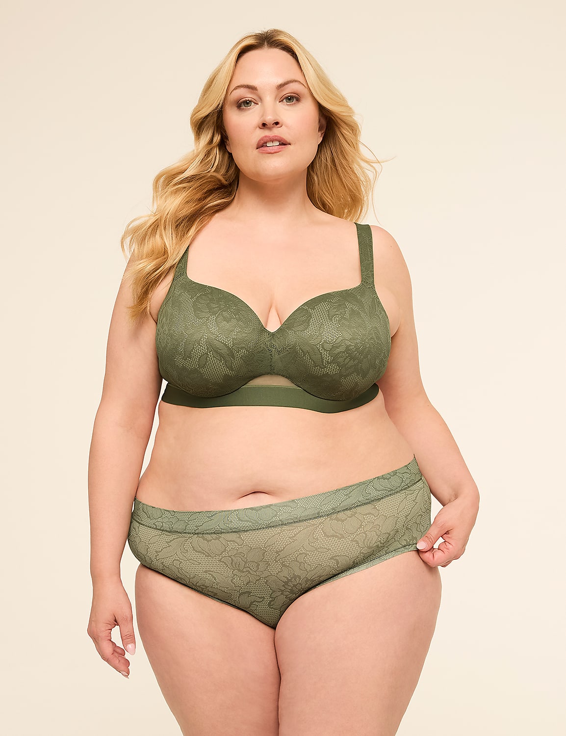 A plus-size woman in a green lace bra and matching underwear stands against a plain, light-colored background. Product Image 4