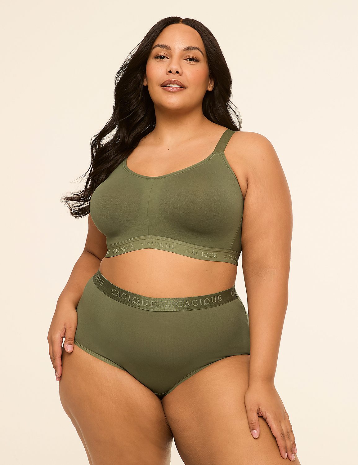 A woman in olive green lingerie stands against a plain, light background. Product Image 4