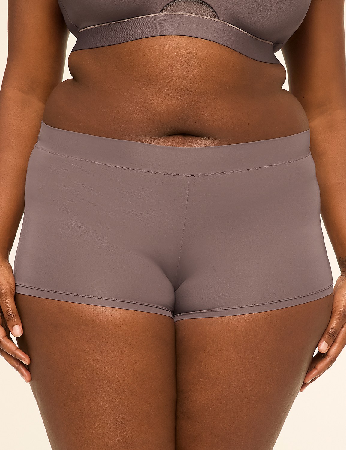 A person in a grey bra and matching underwear stands against a plain background. Product Image 1