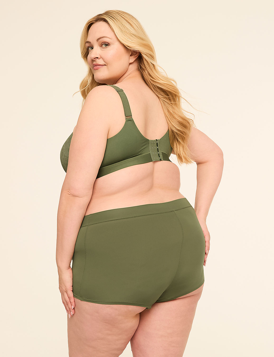 A blonde woman in olive green lingerie stands against a plain, light-colored background. Product Image 2