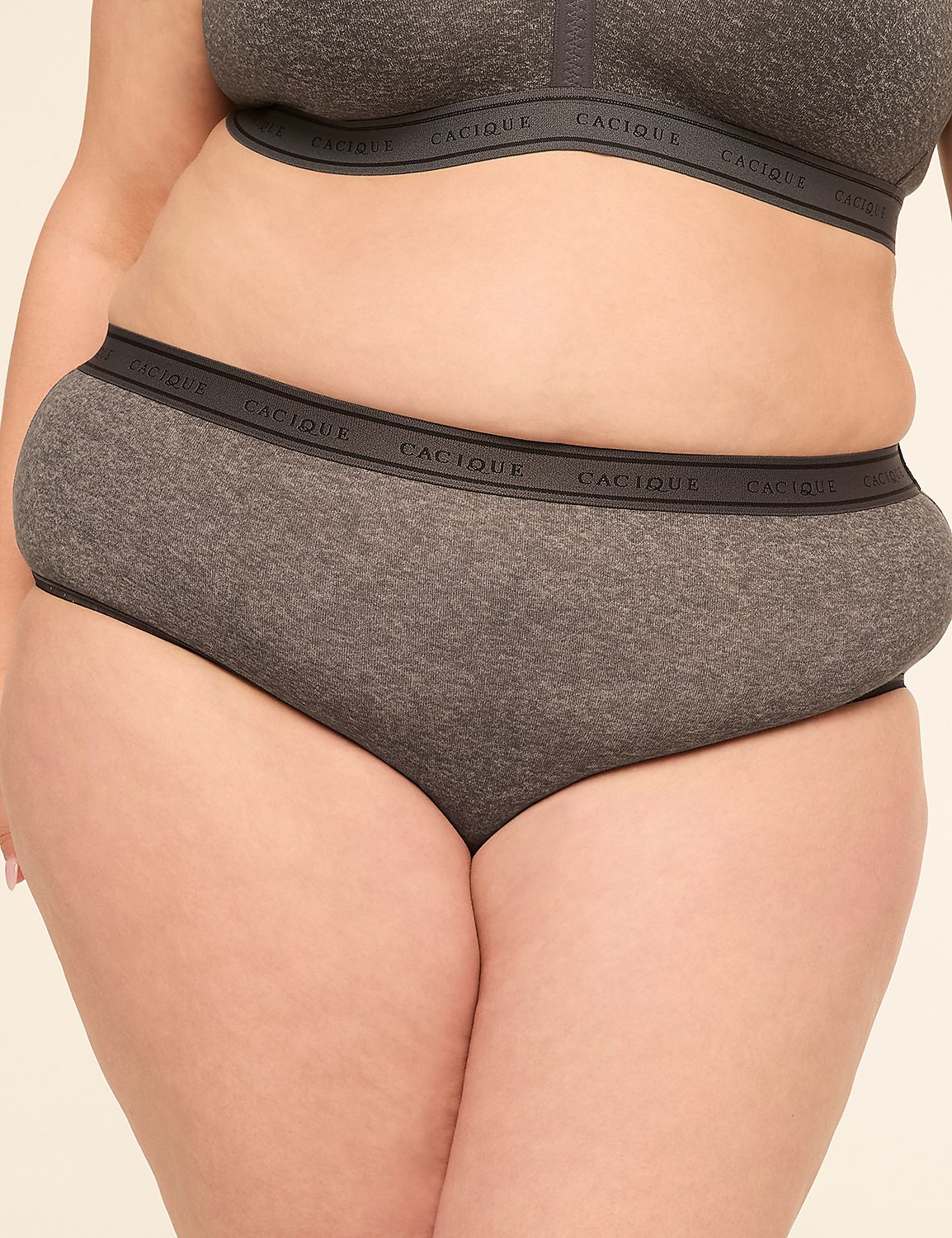 A person in grey underwear with the brand name "Cacique" visible on the waistband stands against a plain, light-colored background. Product Image 1