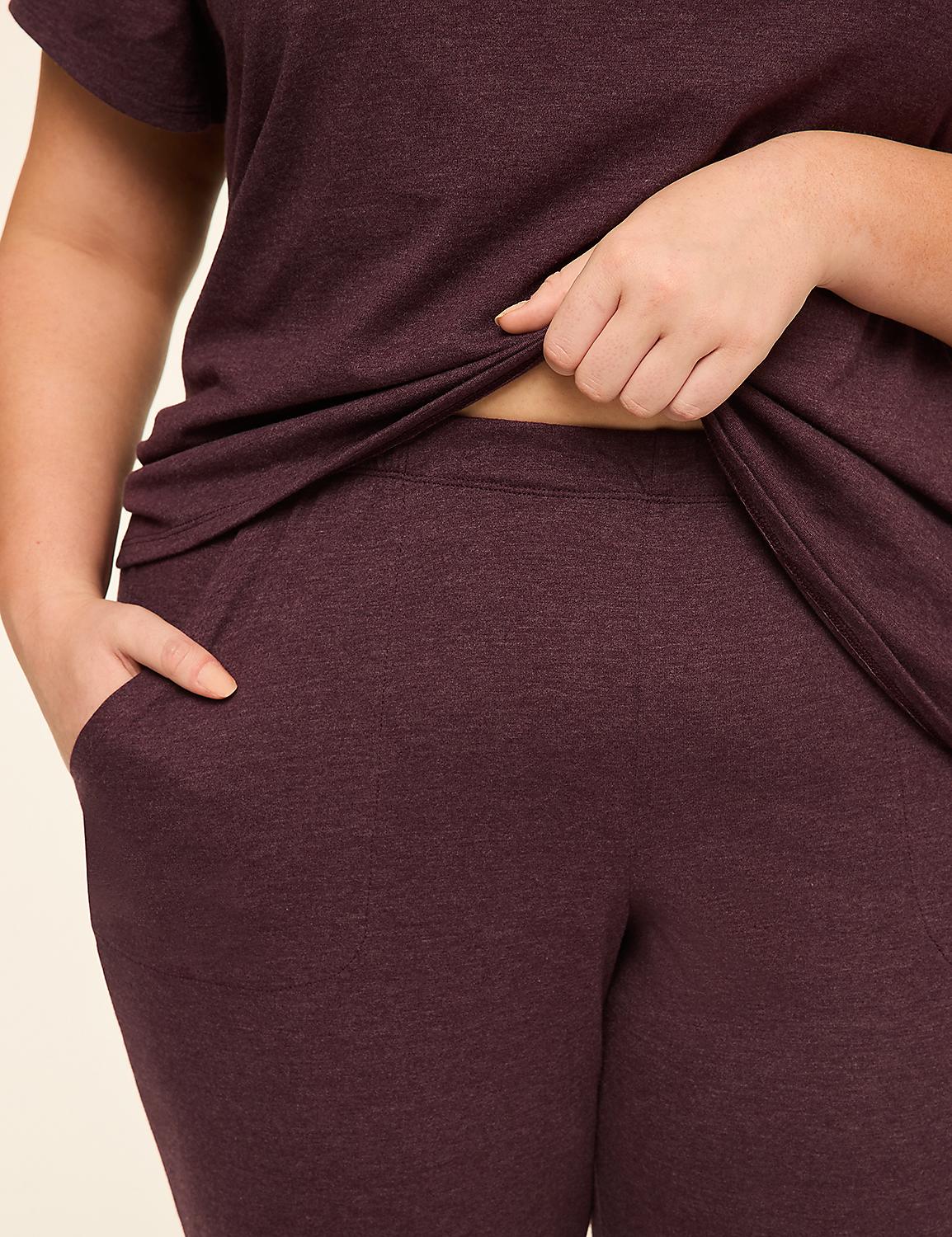 A person in a maroon loungewear set with their hand in their pocket stands against a plain, light-colored background. Product Image 3