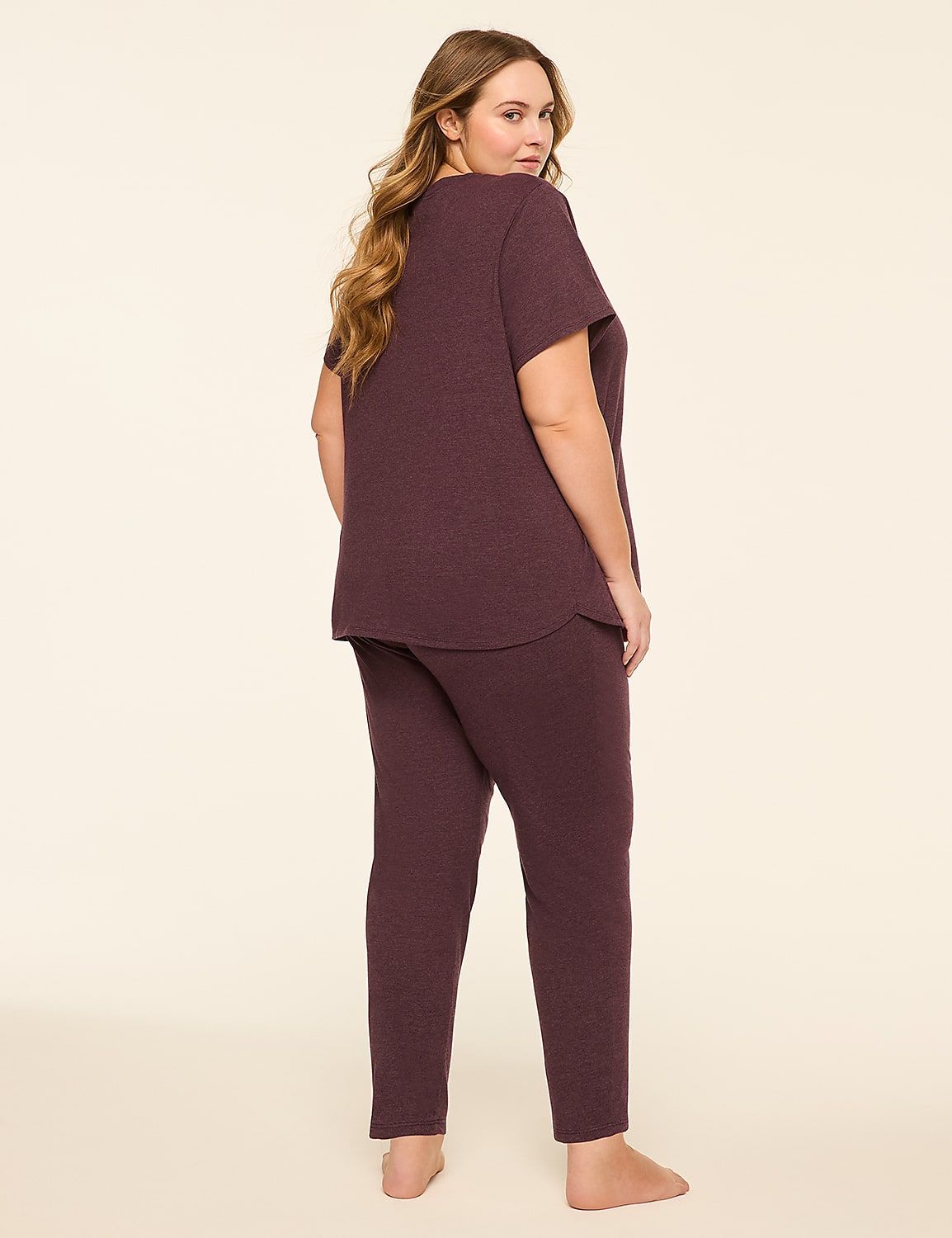 A woman in a maroon pajama set stands against a plain, light-colored background. Product Image 2