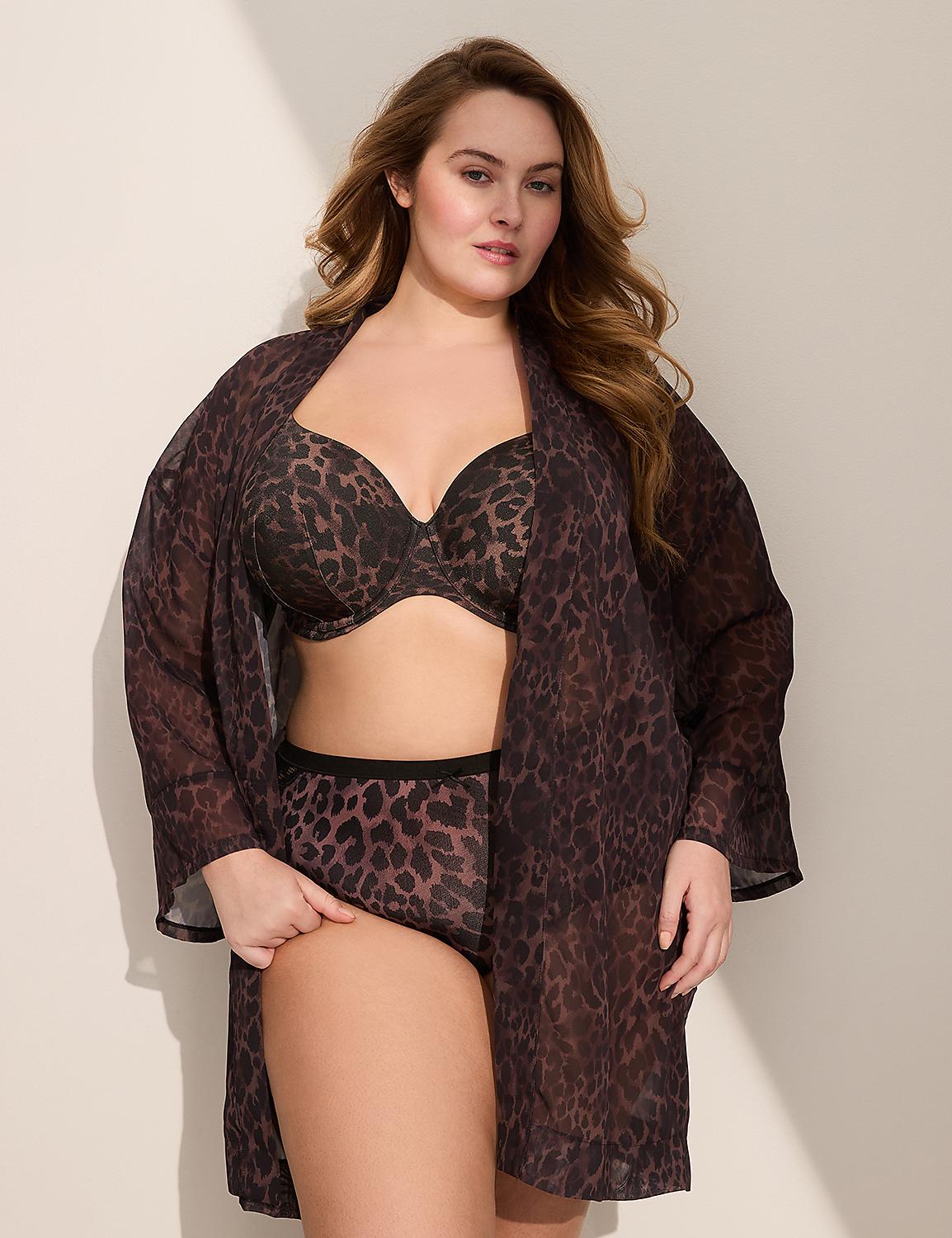A woman in leopard print lingerie and a sheer robe stands against a plain, softly lit background. Product Image 3