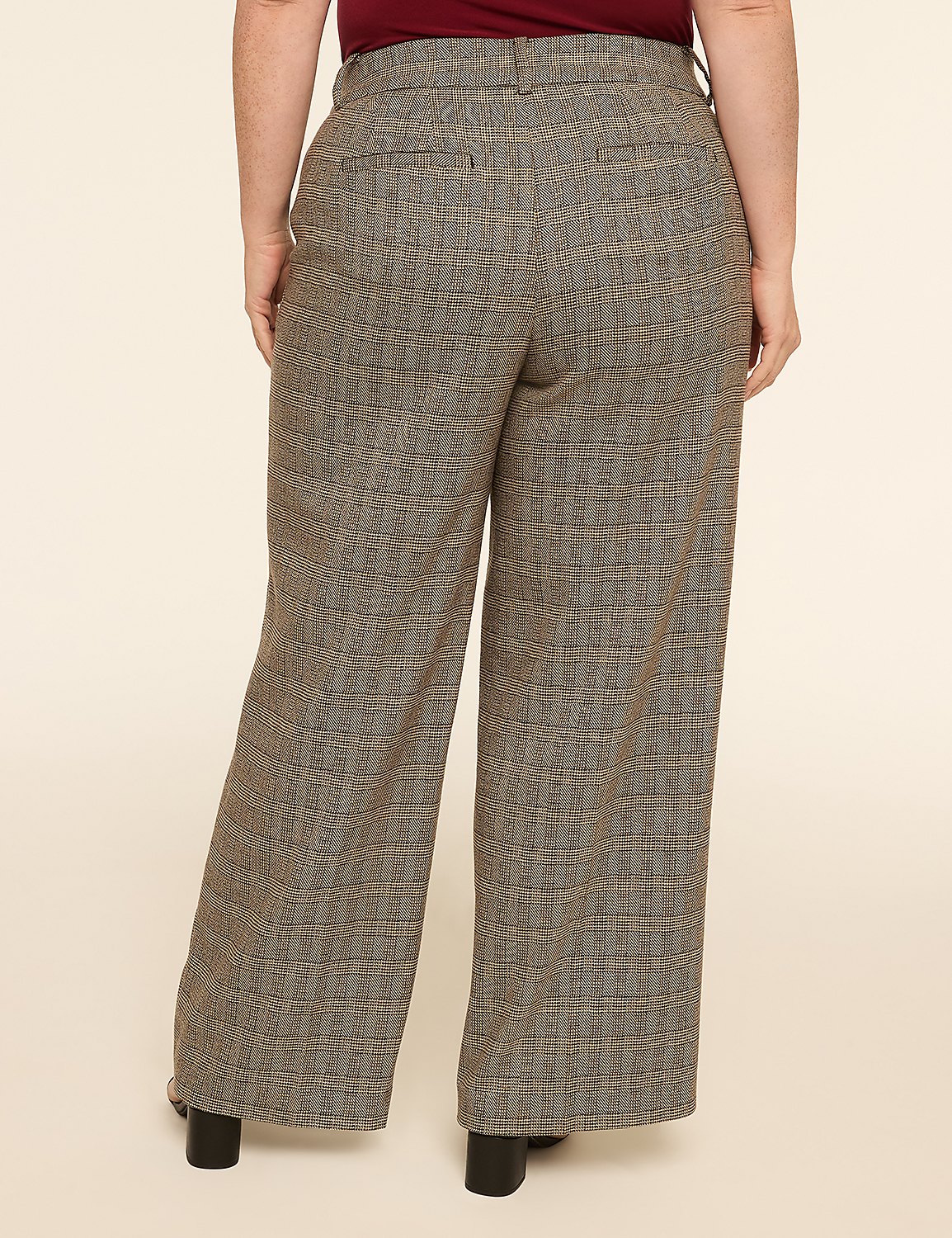 A person wearing patterned wide-leg pants stands against a plain, light-colored background. Product Image 2