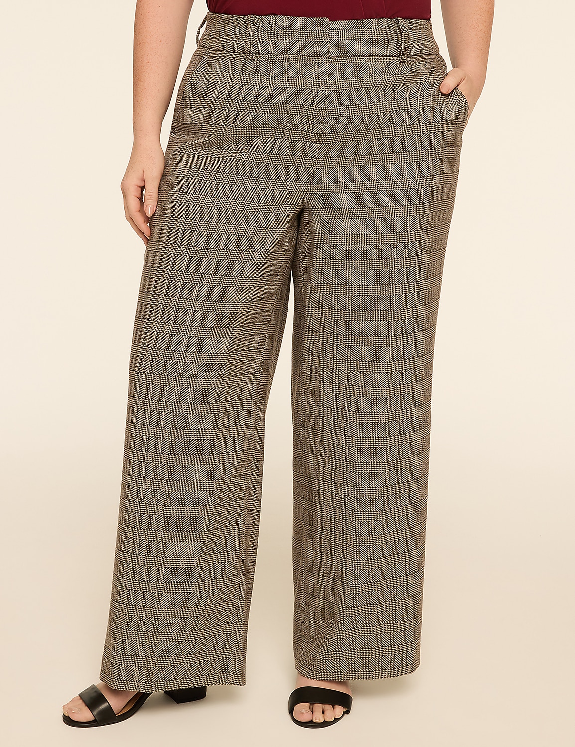 A person wearing wide-leg patterned pants stands against a plain, light-colored background. Product Image 1