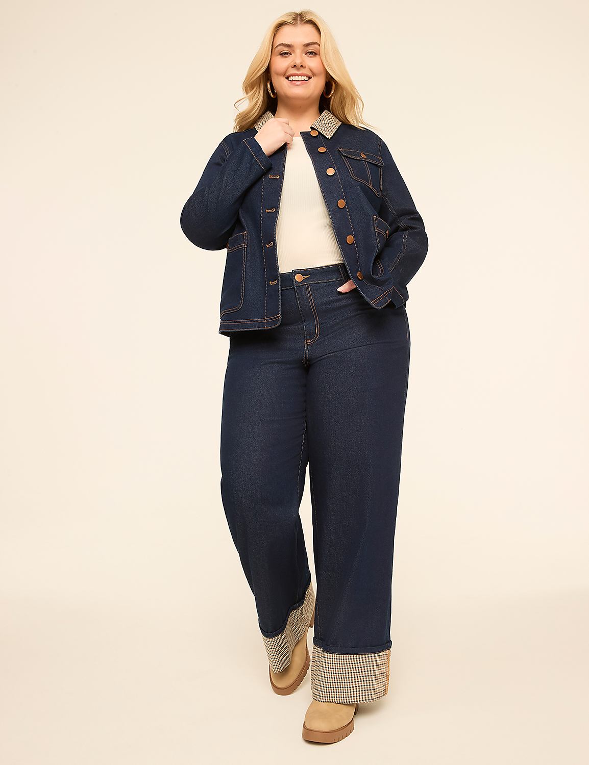 A smiling woman in a denim jacket and wide-leg jeans stands against a plain, light-colored background. Product Image 3