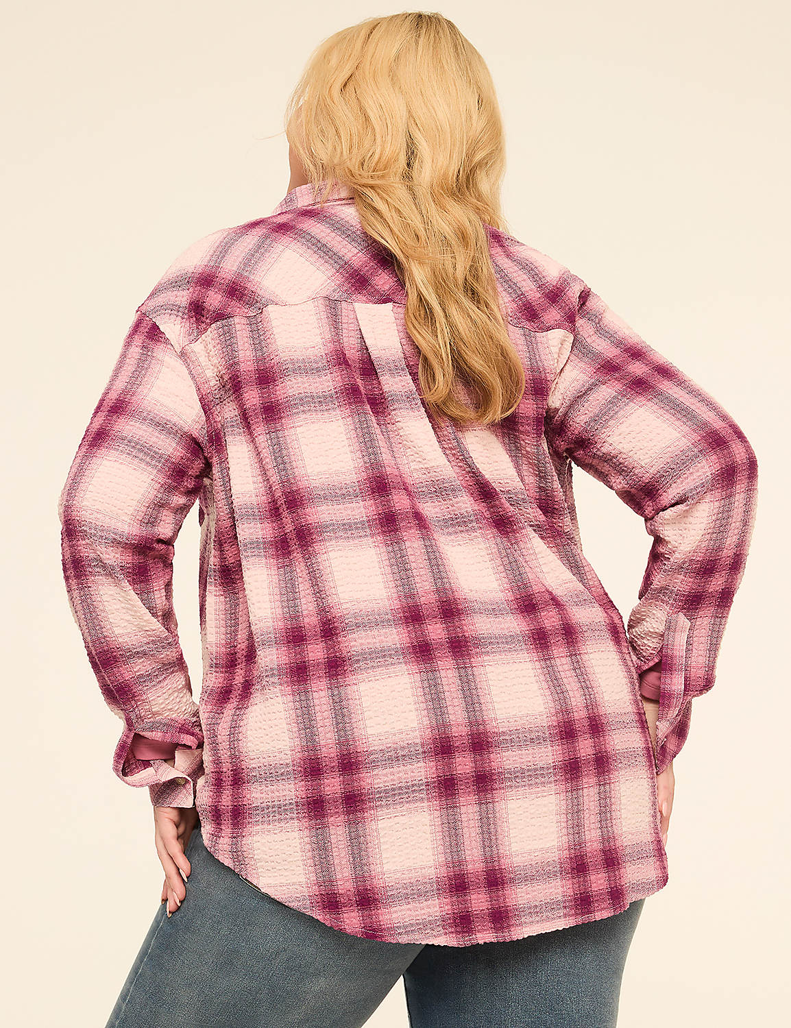 A woman in a pink and purple plaid shirt stands against a plain, light-colored background. Product Image 2