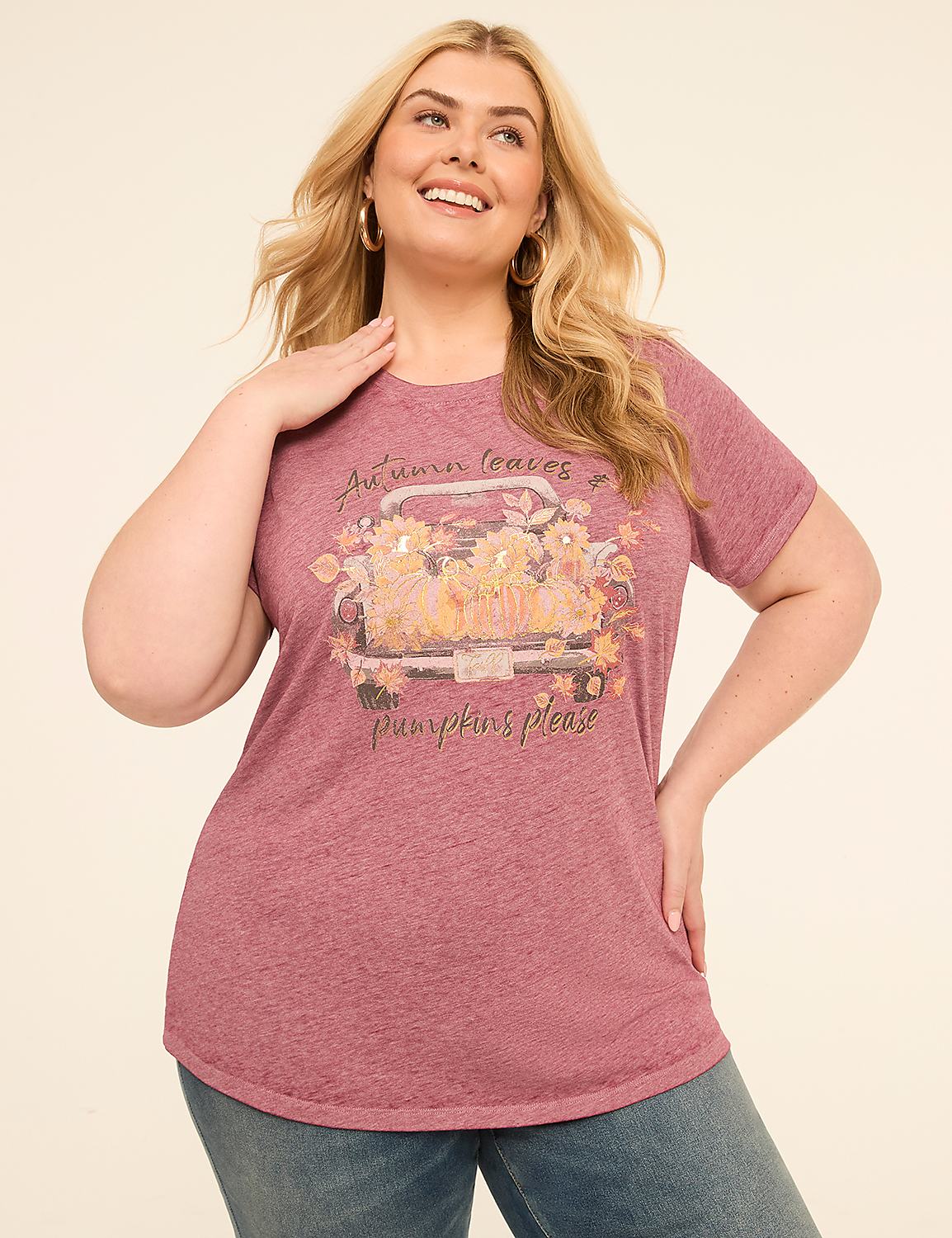 A woman in a maroon t-shirt with a fall-themed graphic stands against a plain, light-colored background. Product Image 1
