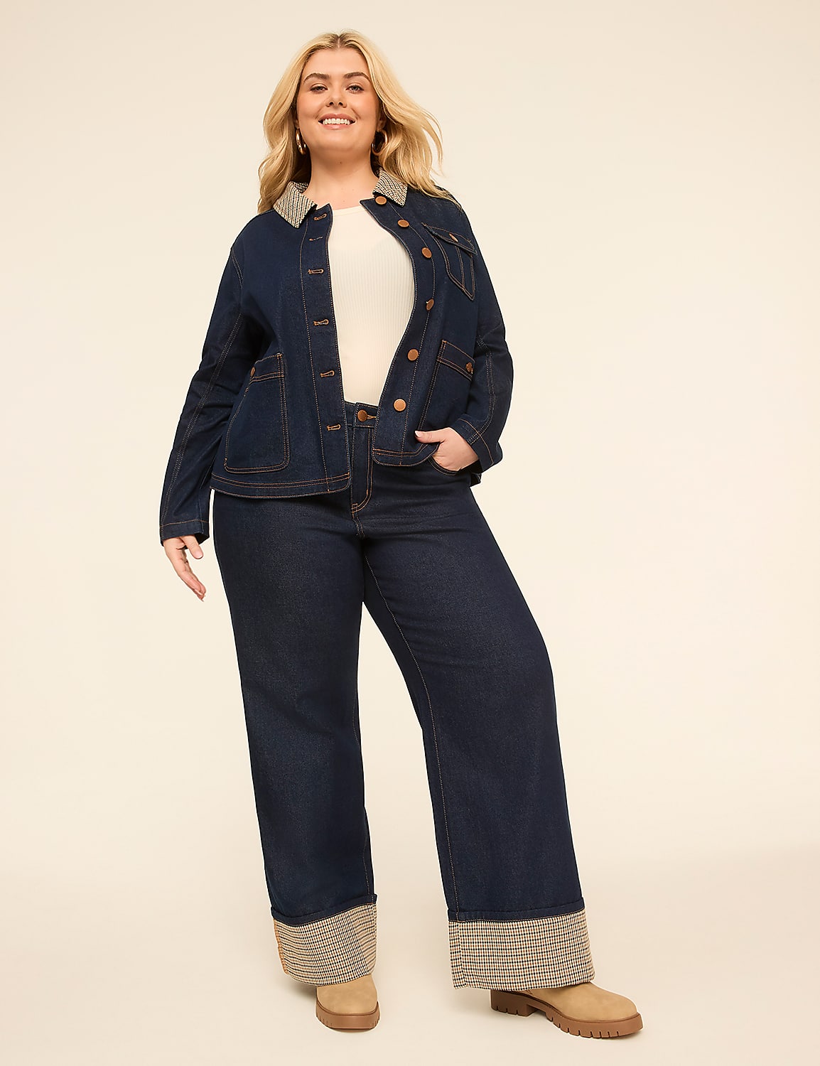 A smiling woman in a denim jacket and wide-leg jeans stands against a plain, light-colored background. Product Image 3