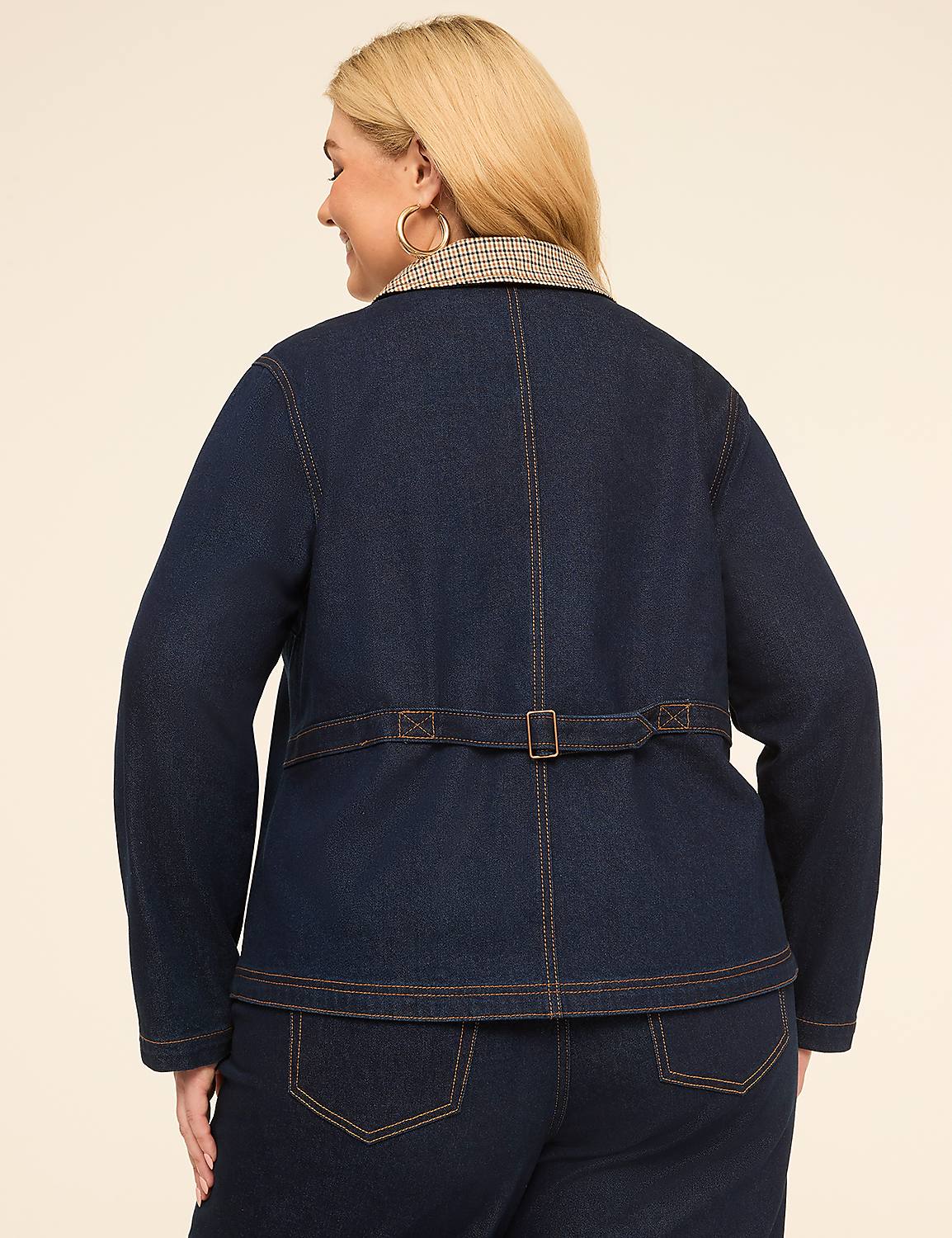 A woman in a denim jacket and jeans stands against a plain, light-colored background. Product Image 2