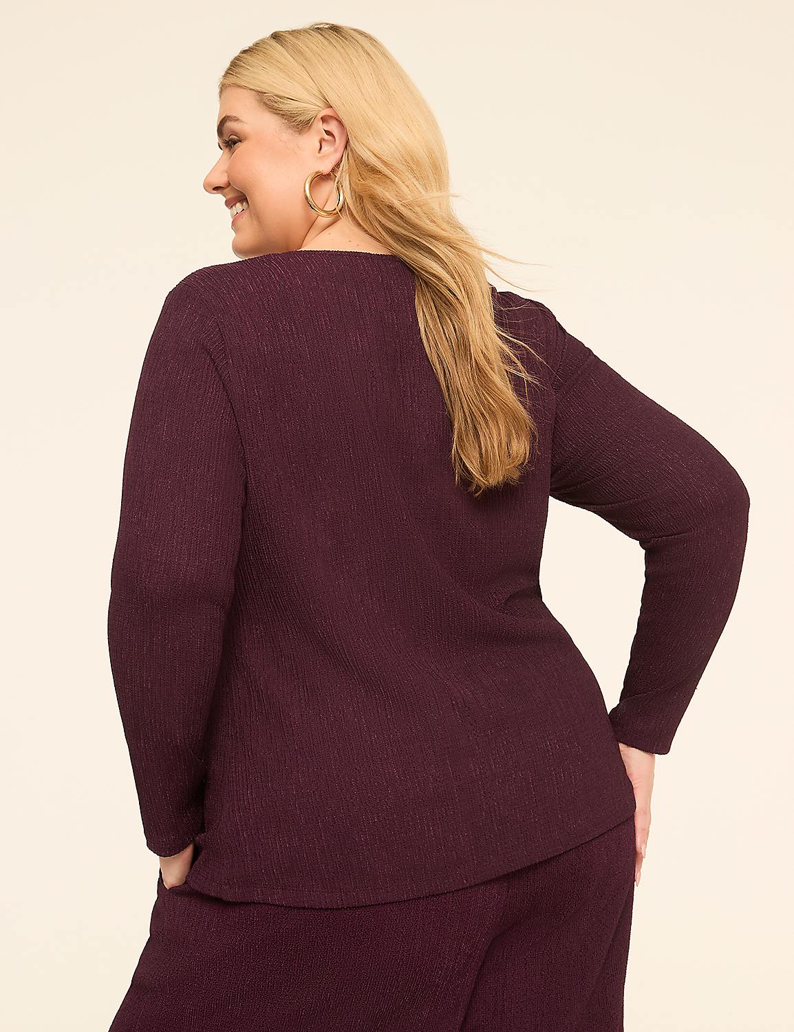 A woman in a burgundy ribbed top and pants stands against a plain, light-colored background. Product Image 2