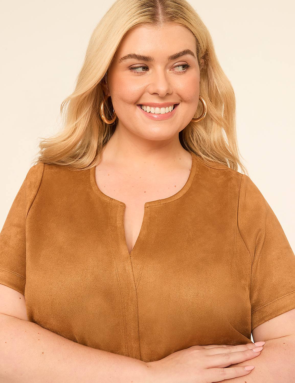 A smiling woman with blonde hair and hoop earrings wears a tan suede top against a plain, light background. Product Image 3