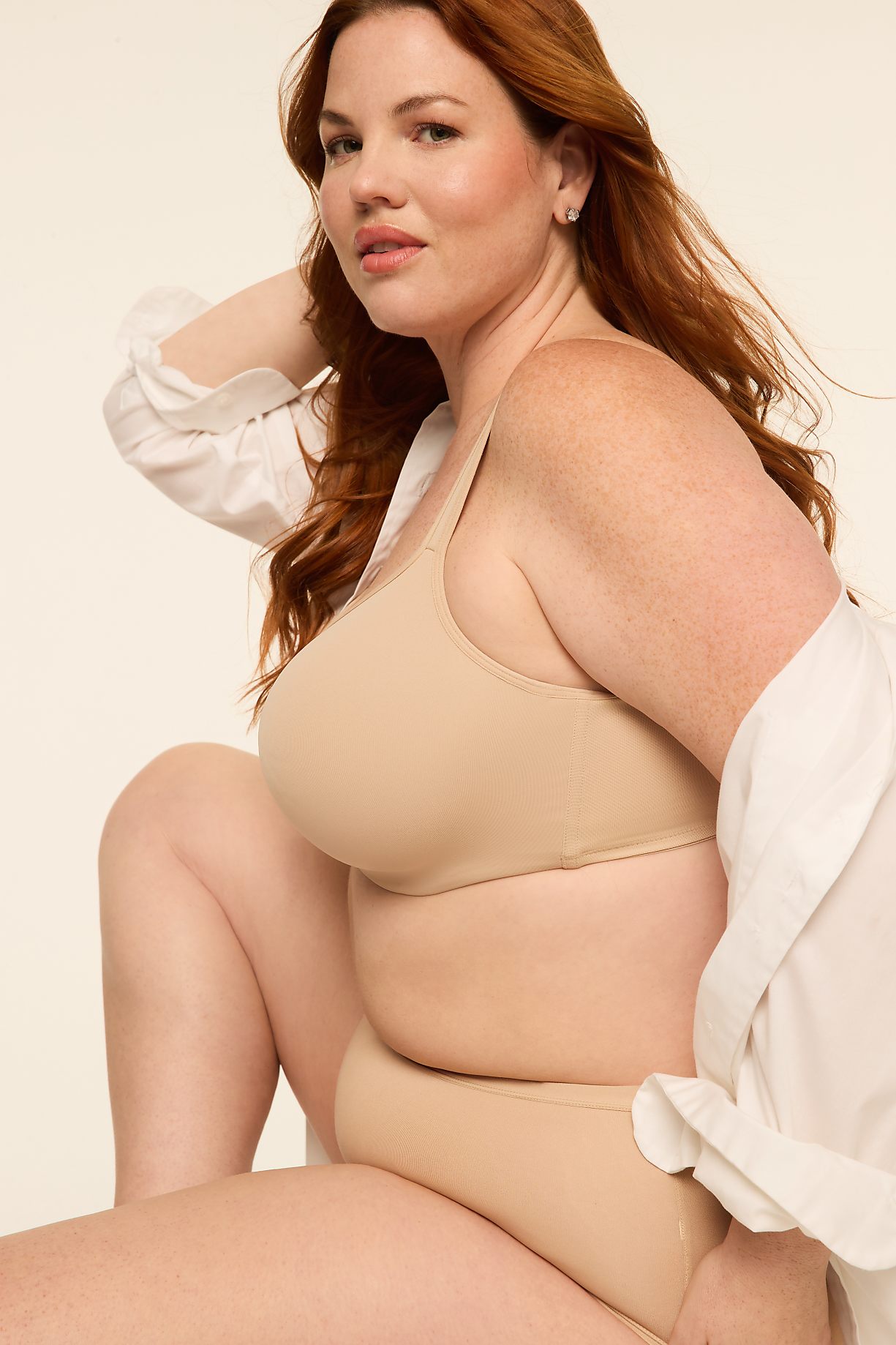 A woman with red hair and fair skin, wearing a beige bra and underwear, poses against a plain, light-colored background. Product Image 9