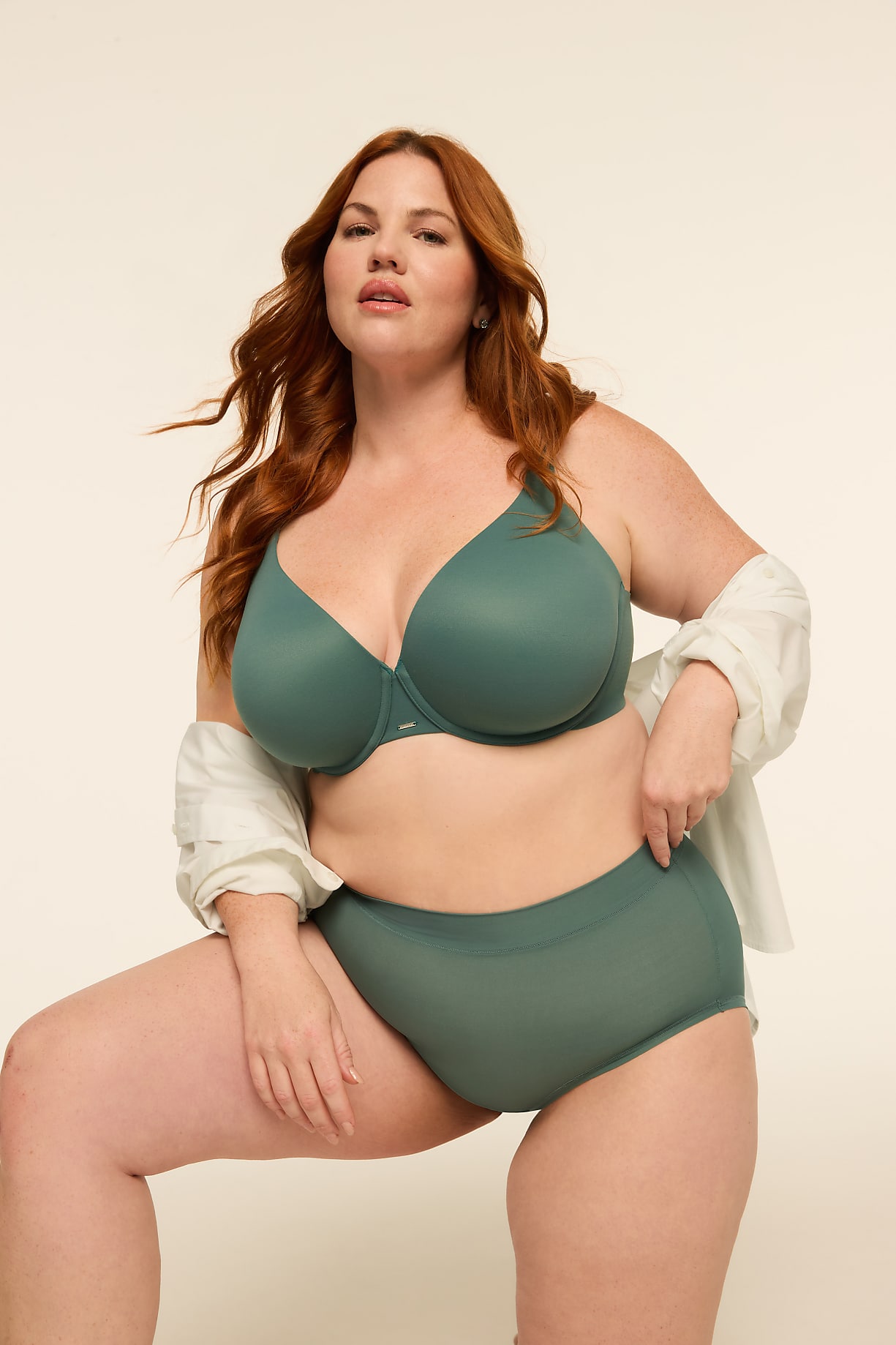 A woman with auburn hair poses in a teal bra and underwear against a plain, light-colored background. Product Image 6