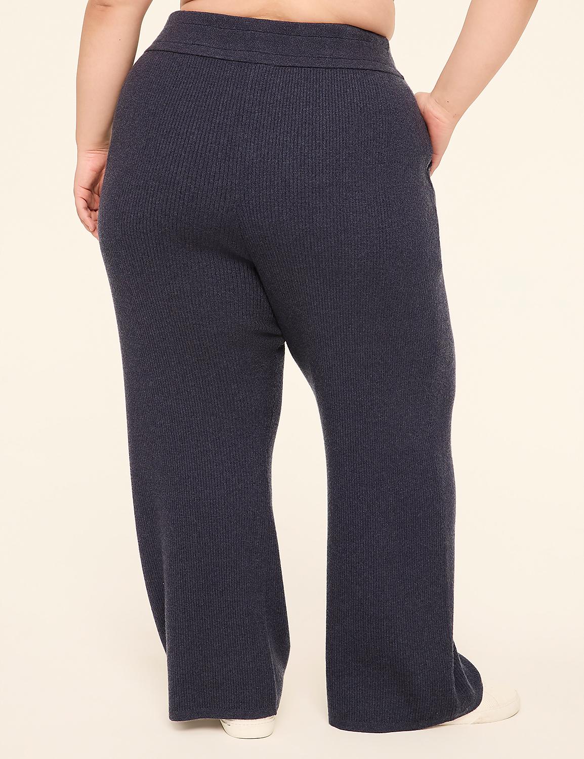 A person wearing dark blue ribbed knit pants stands against a plain, light-colored background. Product Image 2