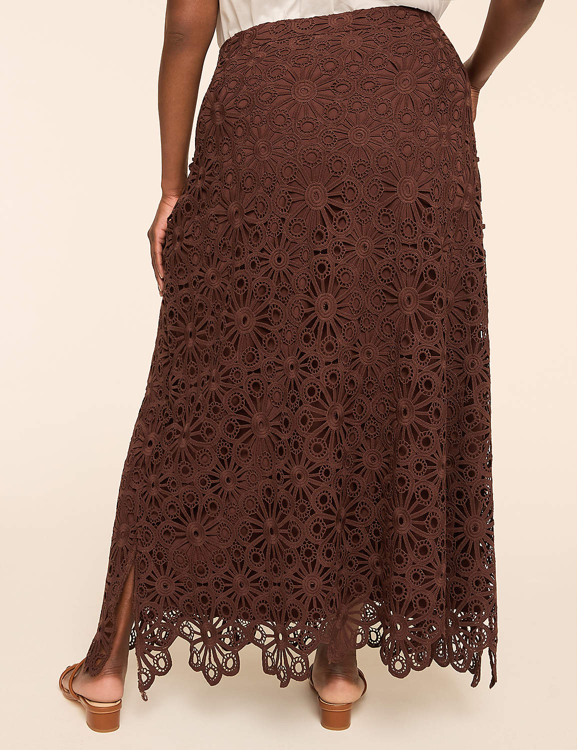 A person in a brown lace maxi skirt with a slit stands against a plain, light-colored background. Product Image 2
