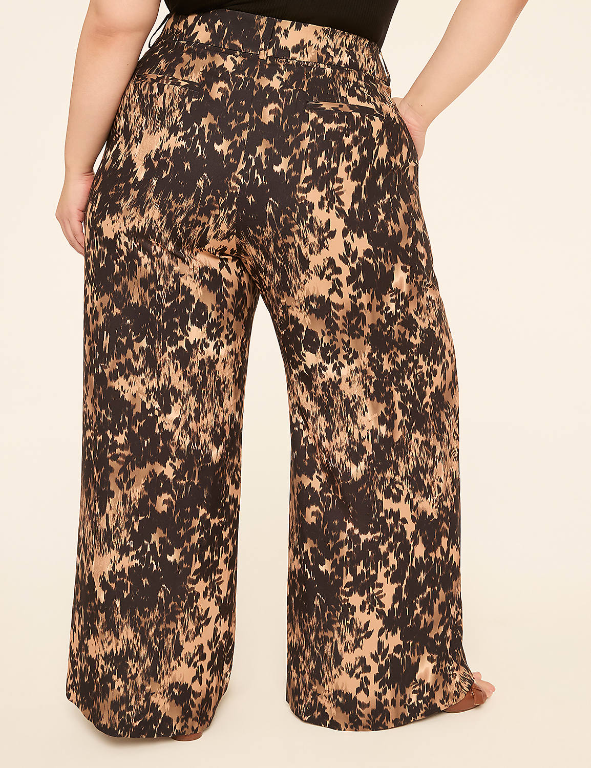 A person wearing wide-leg pants with a brown and black abstract pattern stands against a plain, light-colored background. Product Image 2