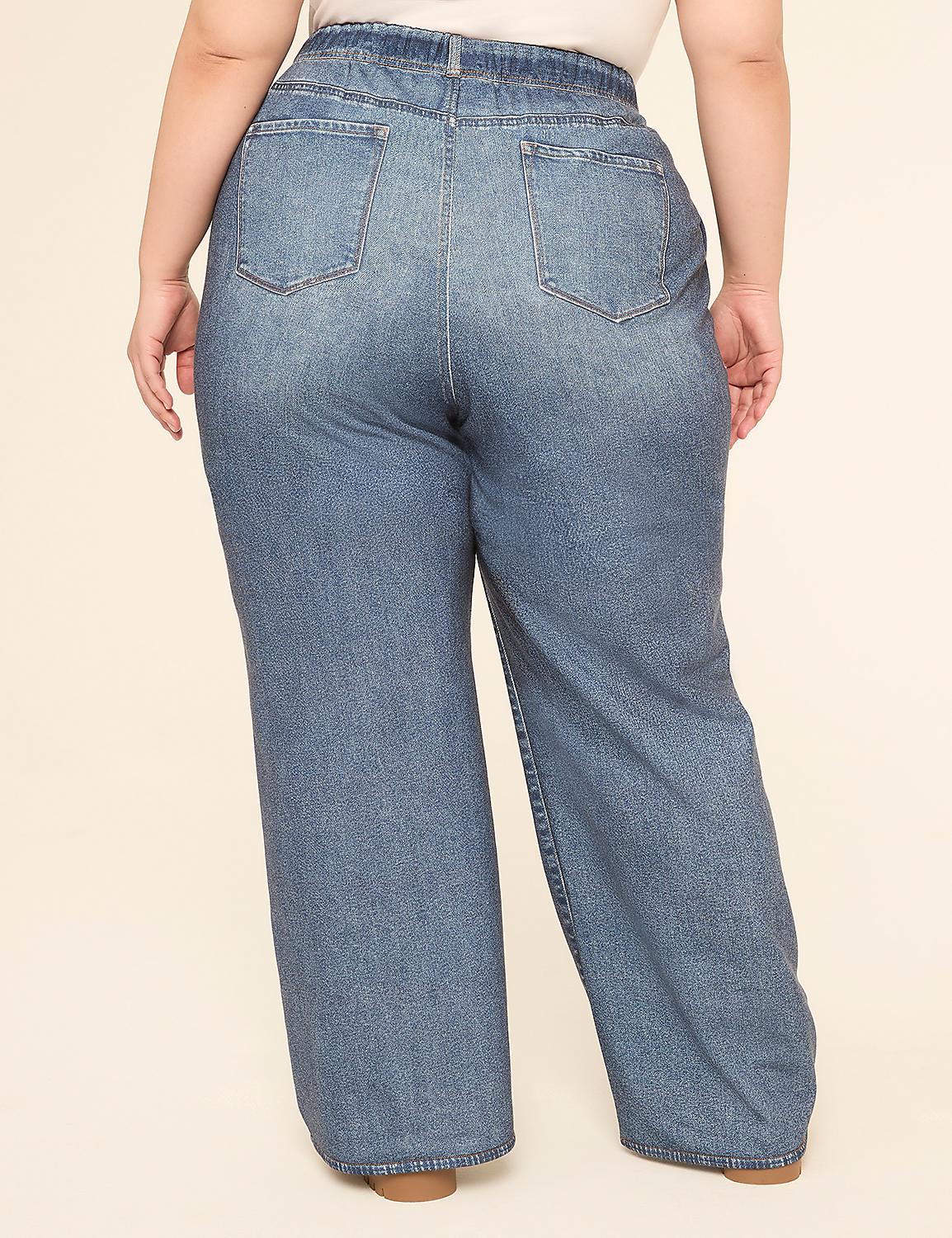 A person wearing loose-fitting denim jeans stands against a plain, light-colored background. Product Image 2