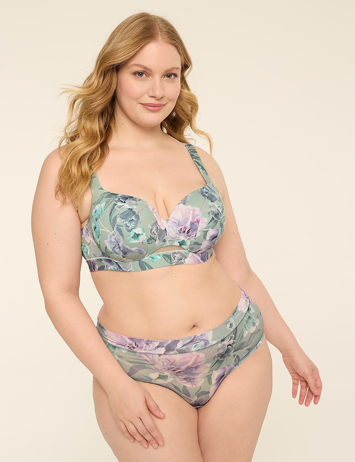 A woman in a floral bra and underwear stands against a plain, light-colored background. Product Image 3