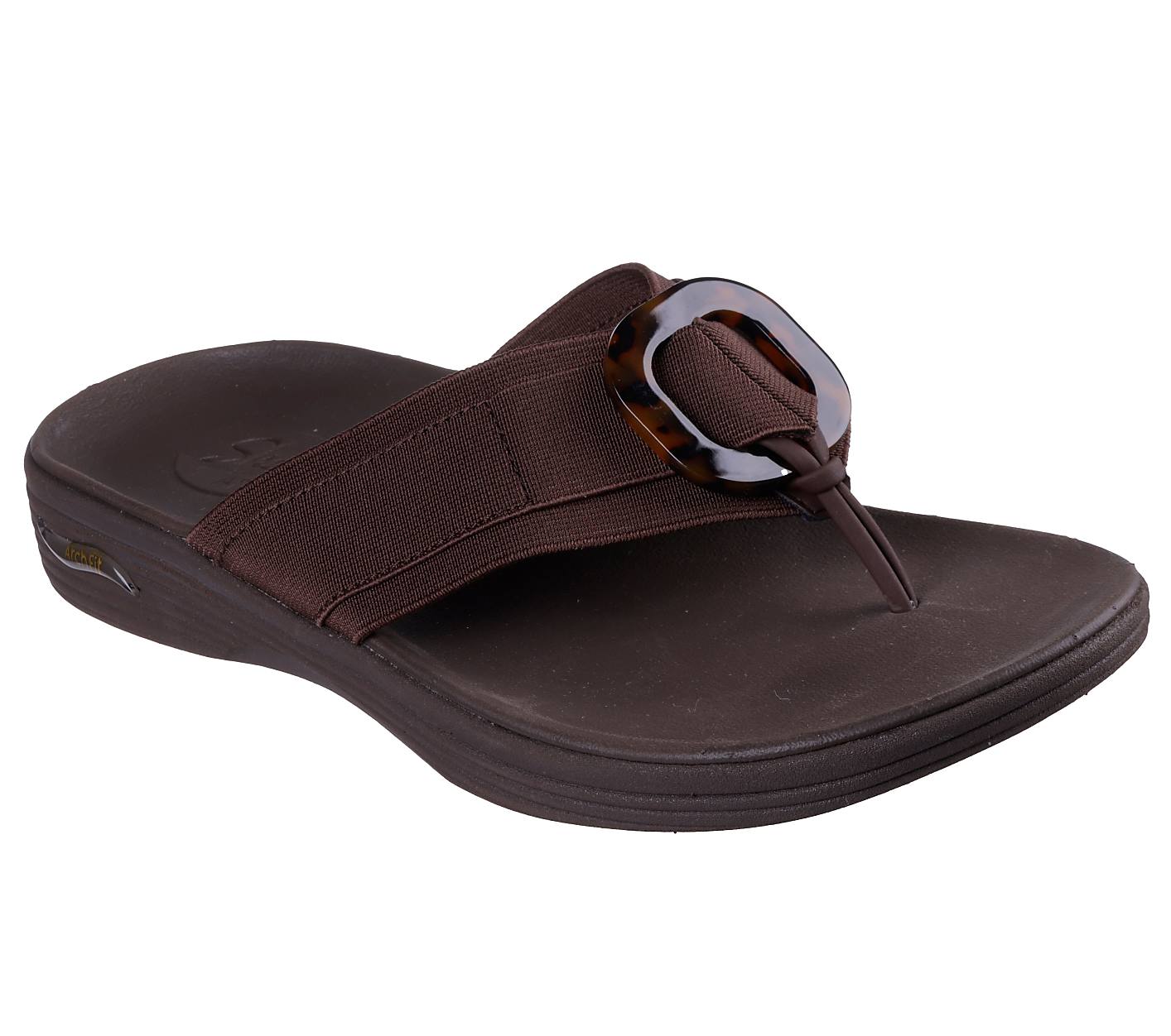 A brown flip-flop sandal with a tortoiseshell buckle sits on a white background. Product Image 1