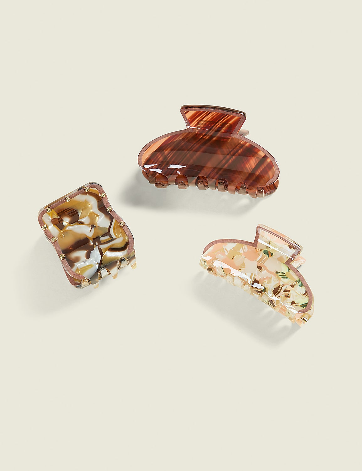 Three patterned hair clips are arranged on a plain, light-colored background. Product Image 1