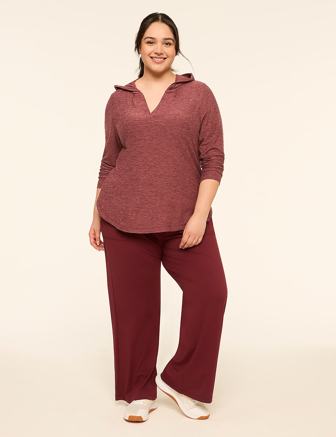 A smiling woman in a maroon hooded top and matching wide-leg pants stands against a plain, light-colored background. Product Image 3