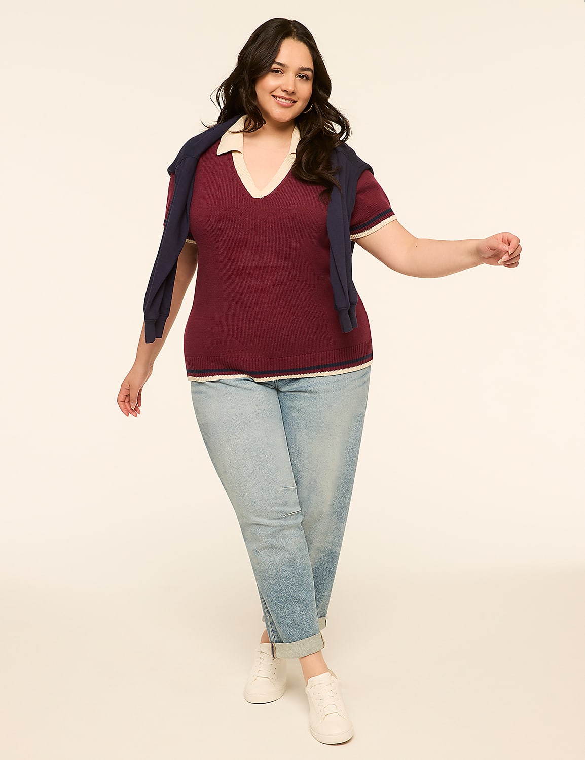 A smiling woman in a maroon sweater and light blue jeans stands against a plain, light-colored background. Product Image 3