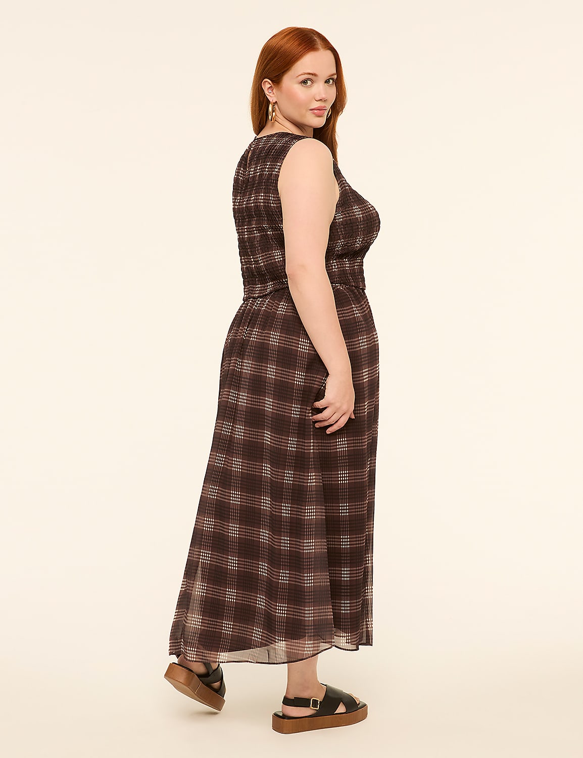 A woman with red hair in a plaid dress and platform sandals stands against a plain, light-colored background. Product Image 2