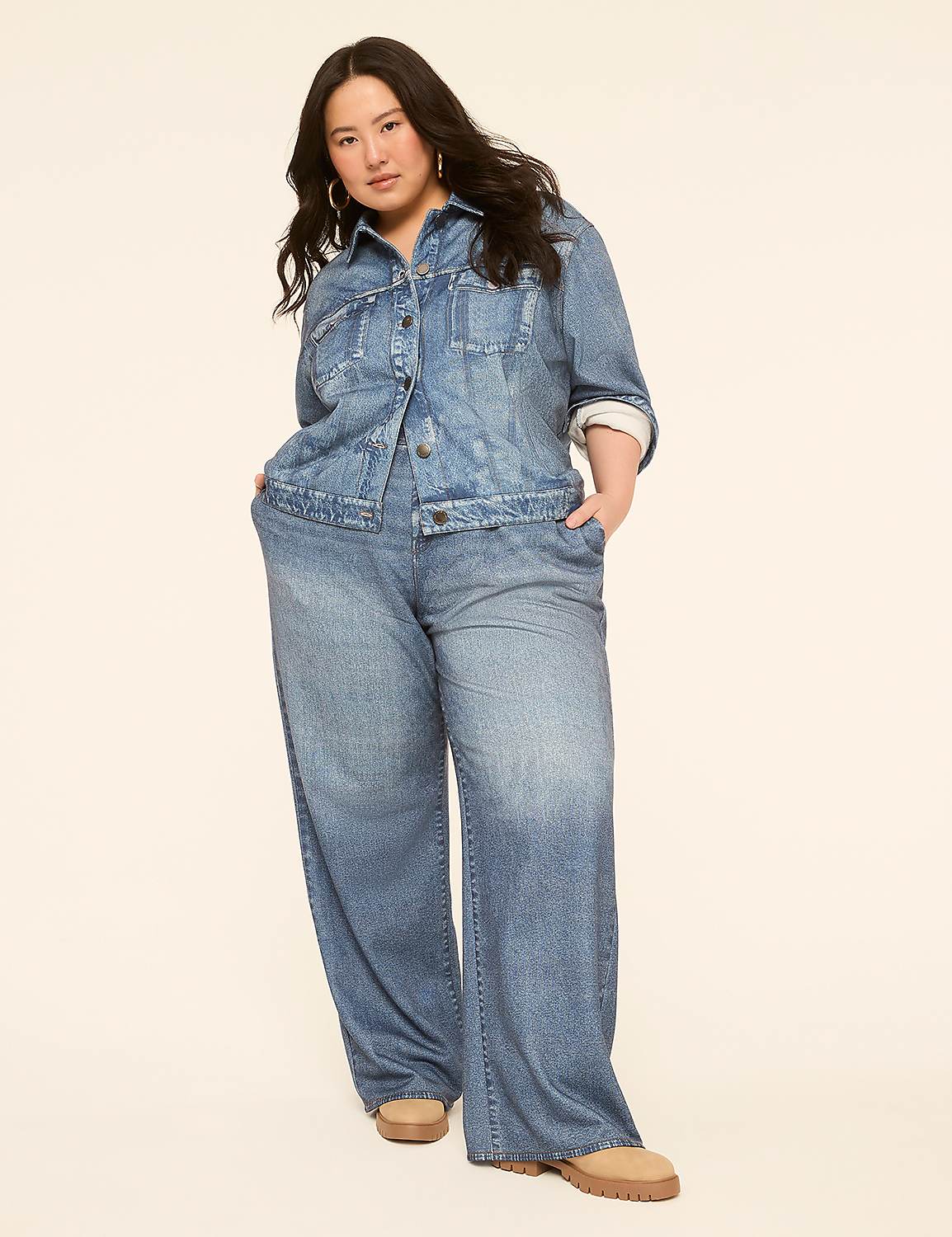 A woman in a denim jacket and wide-leg jeans stands against a plain, light-colored background. Product Image 3