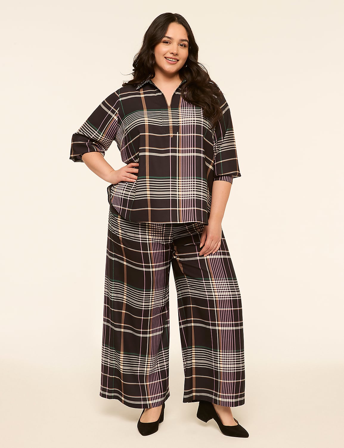 A woman in a plaid outfit stands against a plain, light-colored background. Product Image 3
