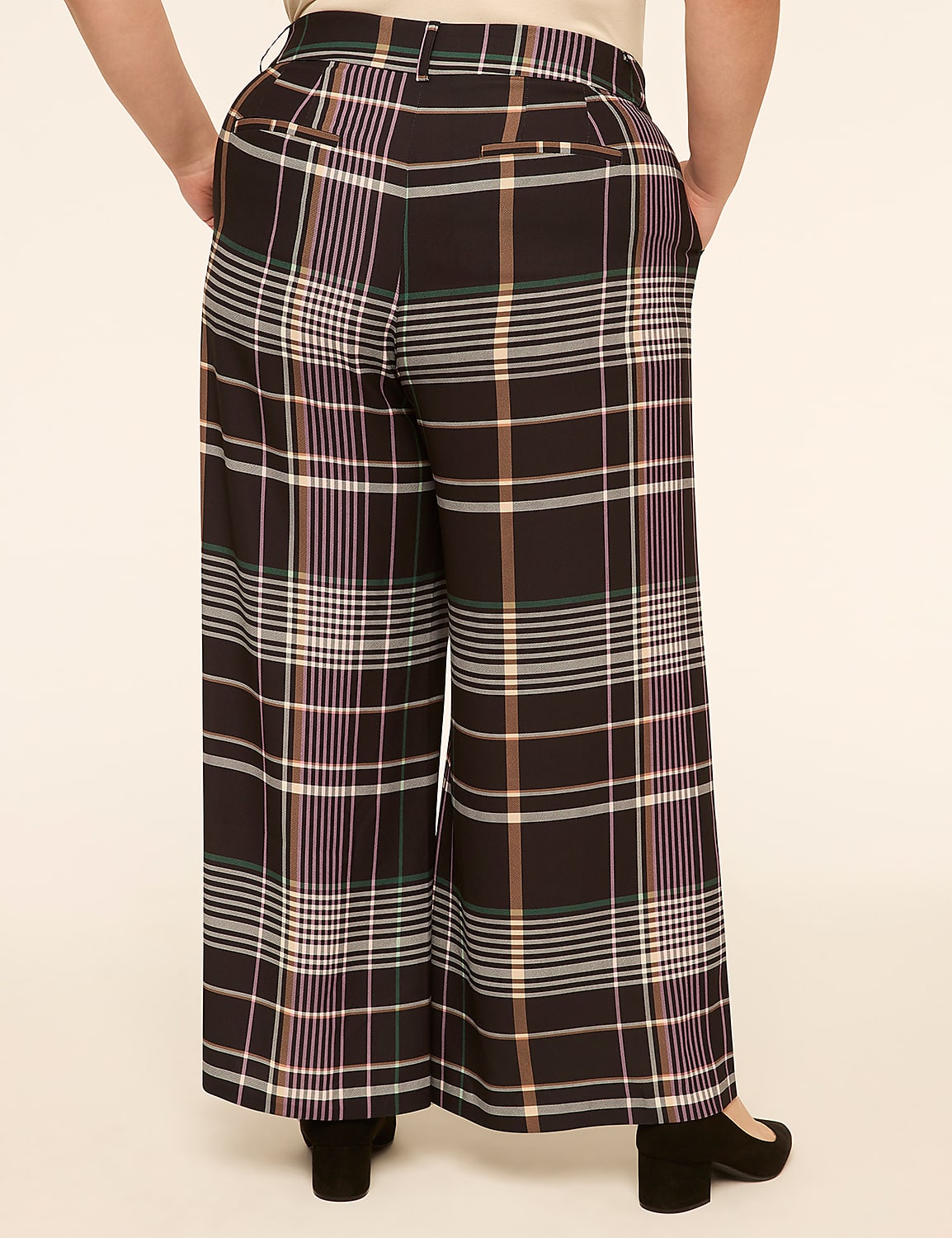 A person wearing wide-leg plaid pants stands against a plain, light-colored background. Product Image 2