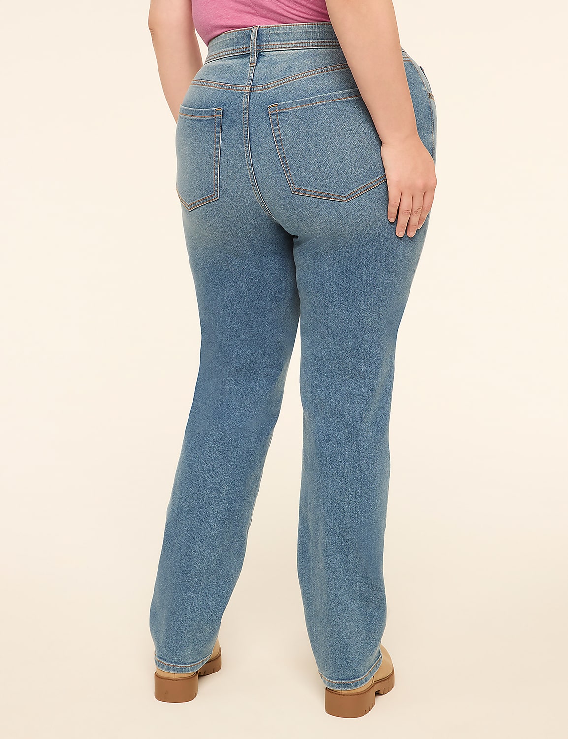 A person wearing light-wash denim jeans and tan platform shoes stands against a plain, light-colored background. Product Image 2