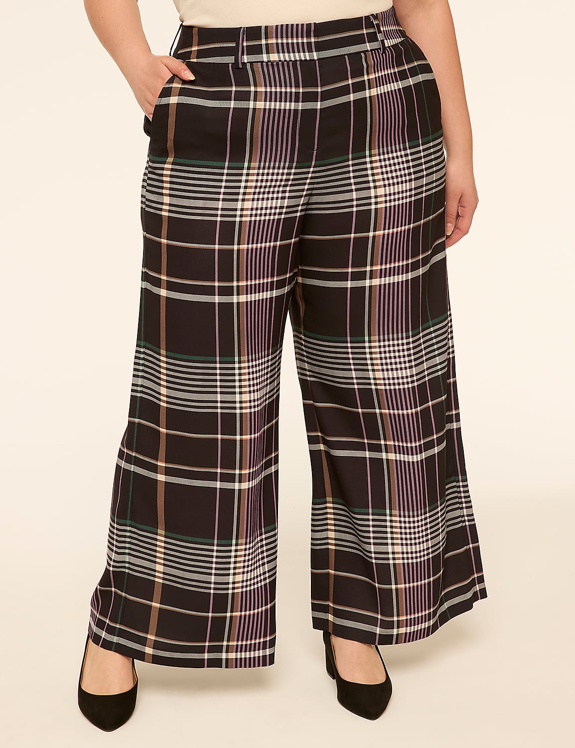 A person stands in wide-leg plaid pants and black heels against a plain, light-colored background. Product Image 1