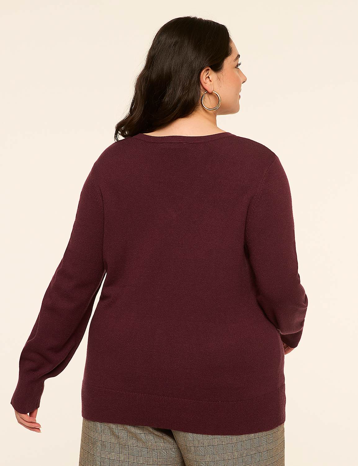 A woman in a maroon sweater and plaid pants stands against a plain, light-colored background. Product Image 2