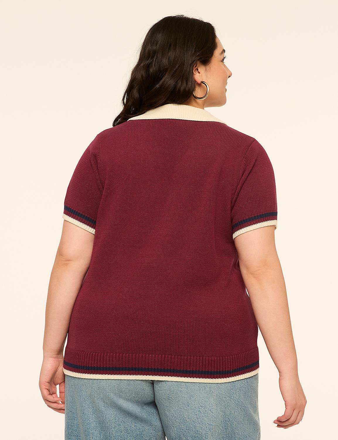 A woman in a maroon polo shirt and blue jeans stands against a plain, light-colored background. Product Image 2