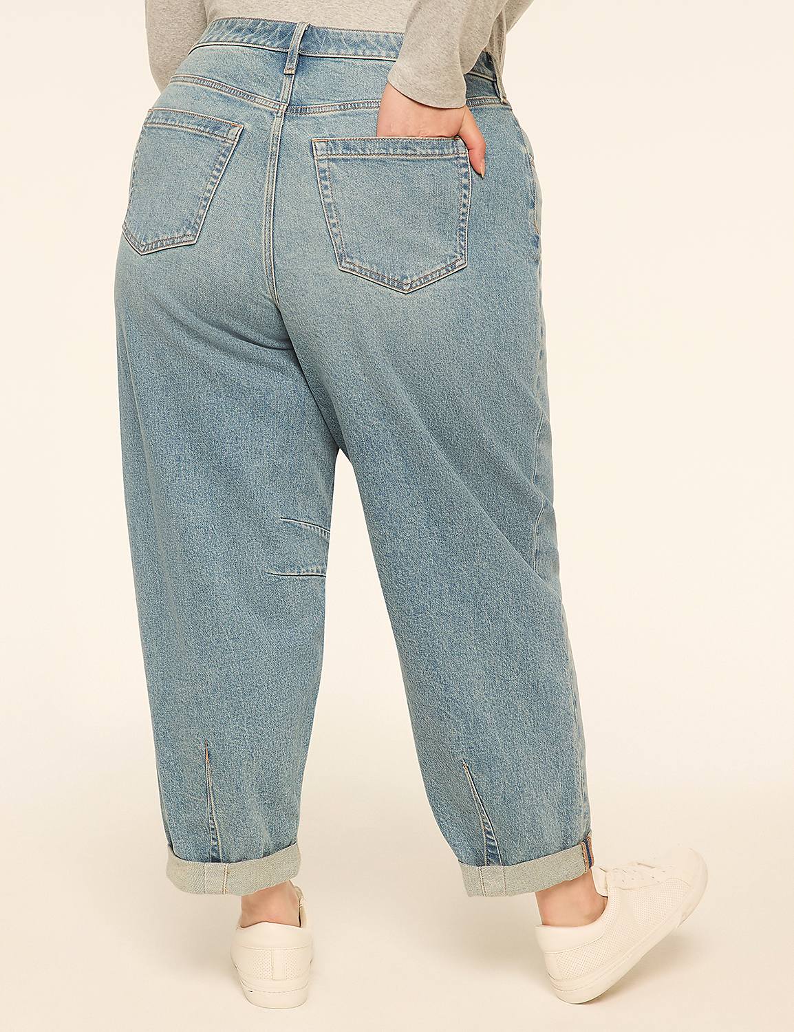A person in light-wash, cuffed jeans and white sneakers stands against a plain, light-colored background. Product Image 2