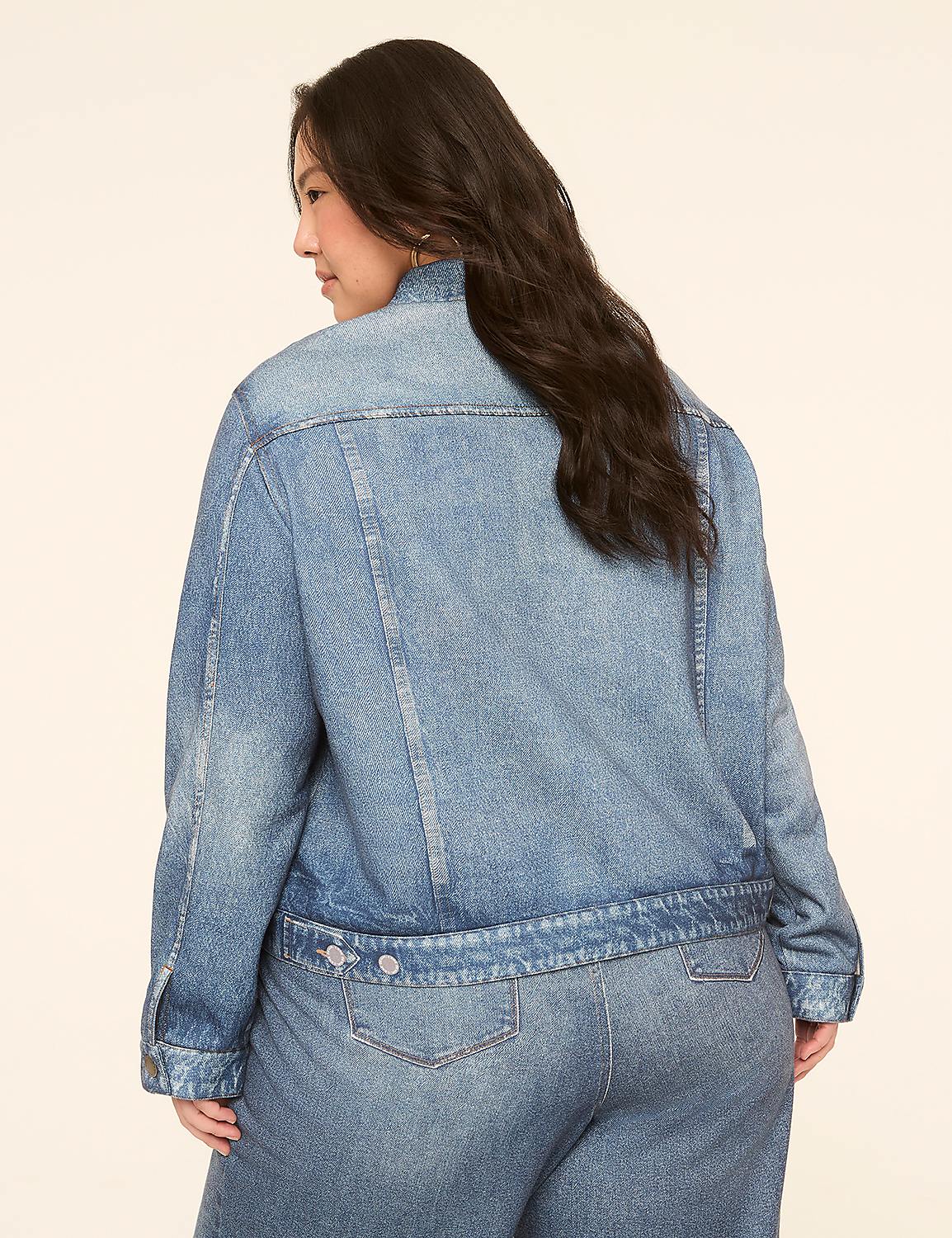 A woman in a denim jacket and jeans stands against a plain, light-colored background. Product Image 2