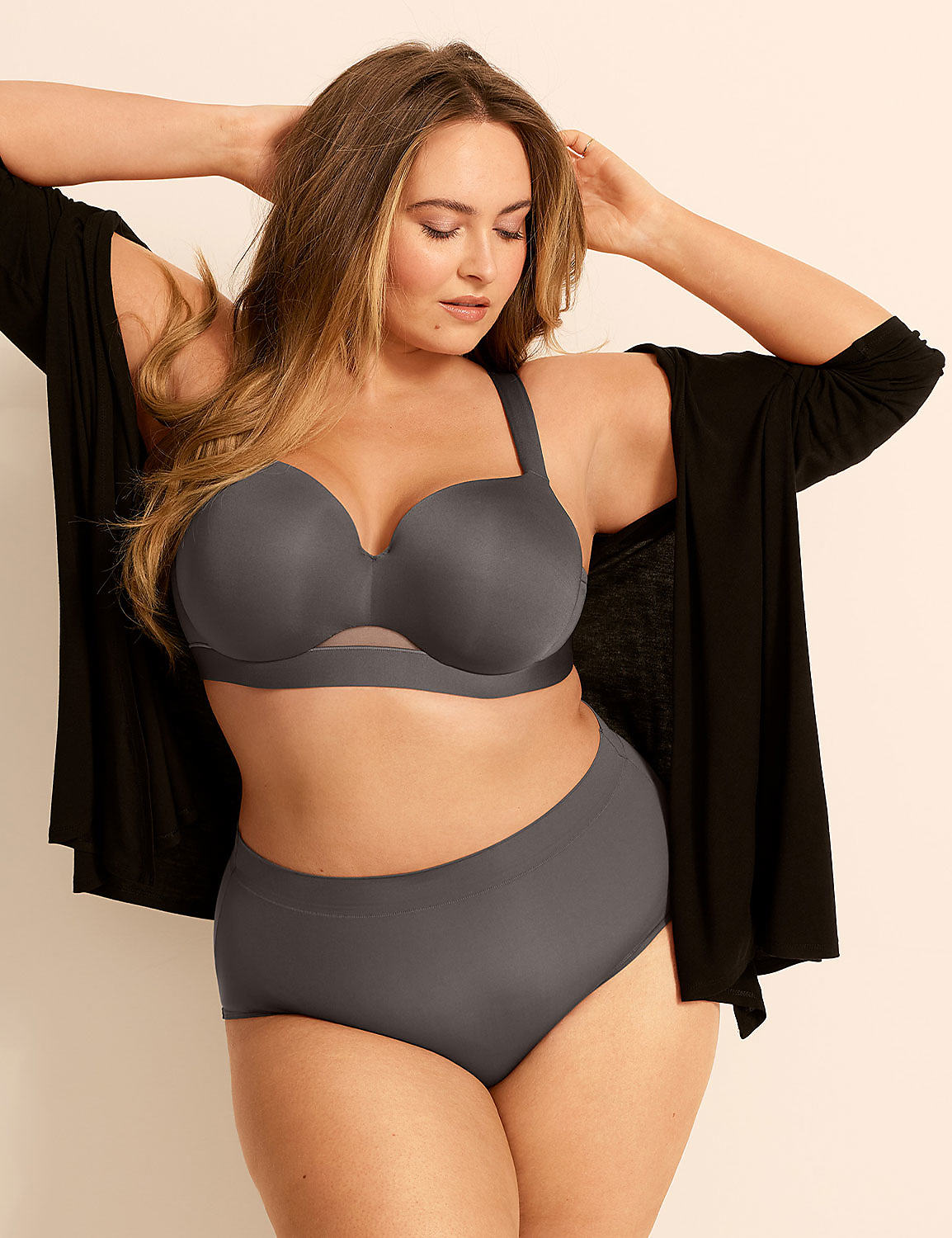 A woman in a grey bra and underwear stands with her arms behind her head, wearing a black robe, against a plain background. Product Image 5