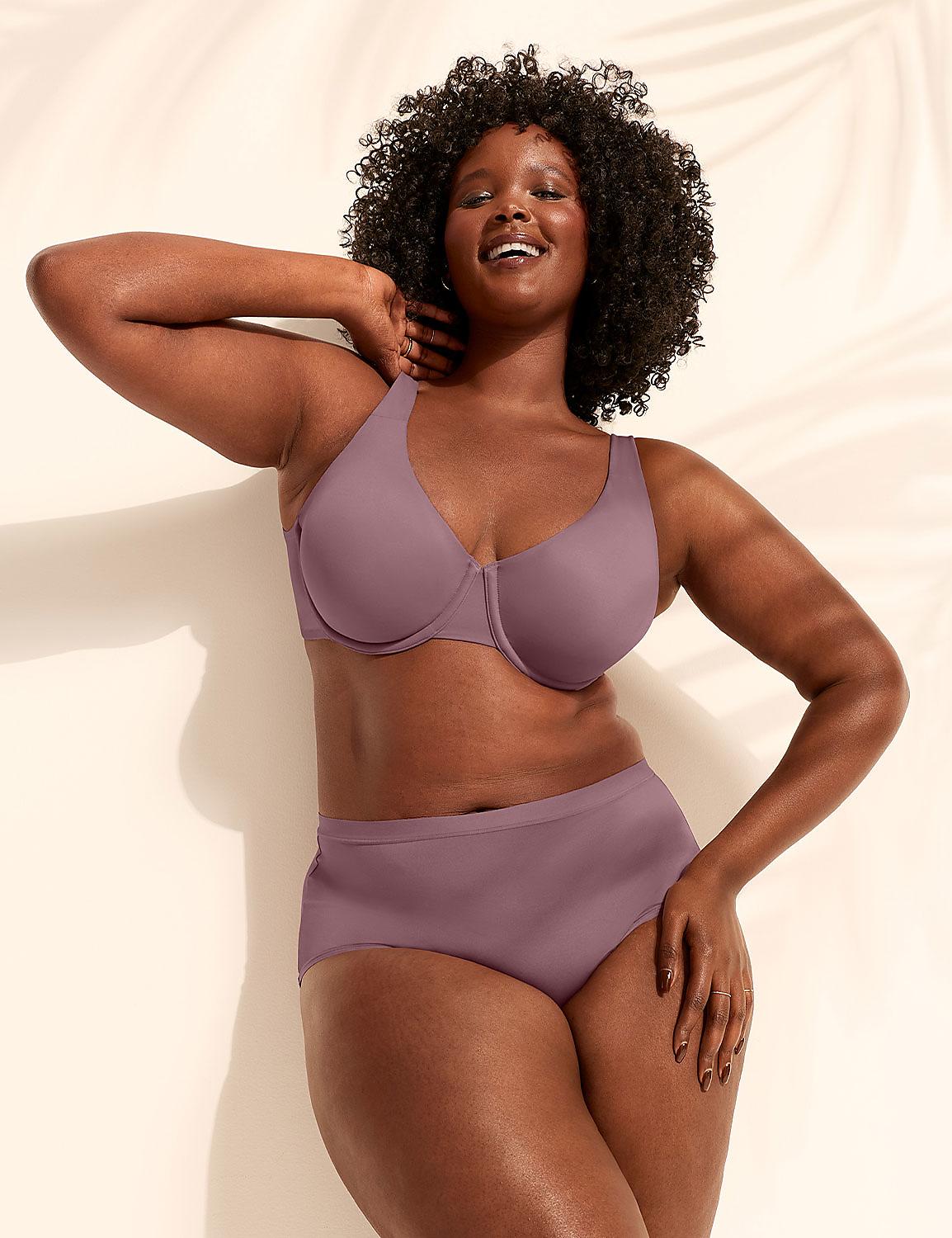 A smiling woman in a mauve bra and underwear stands against a wall with palm leaf shadows. Product Image 4