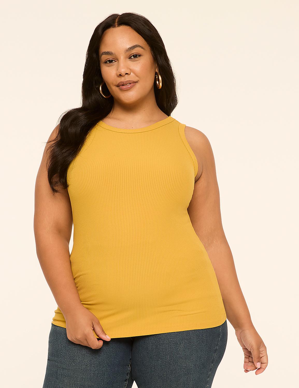 A woman in a mustard yellow ribbed tank top and blue jeans stands against a plain, light-colored background. Product Image 1